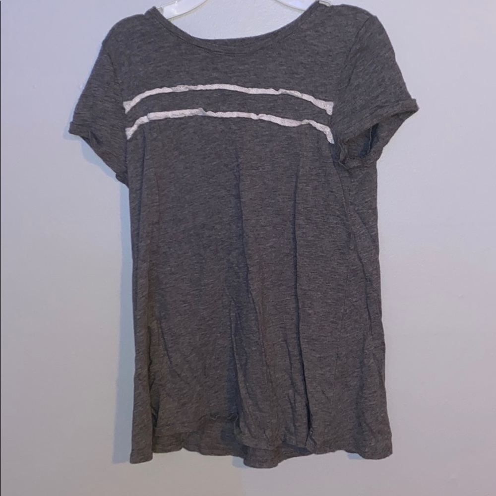 grey shirt w white ruffles